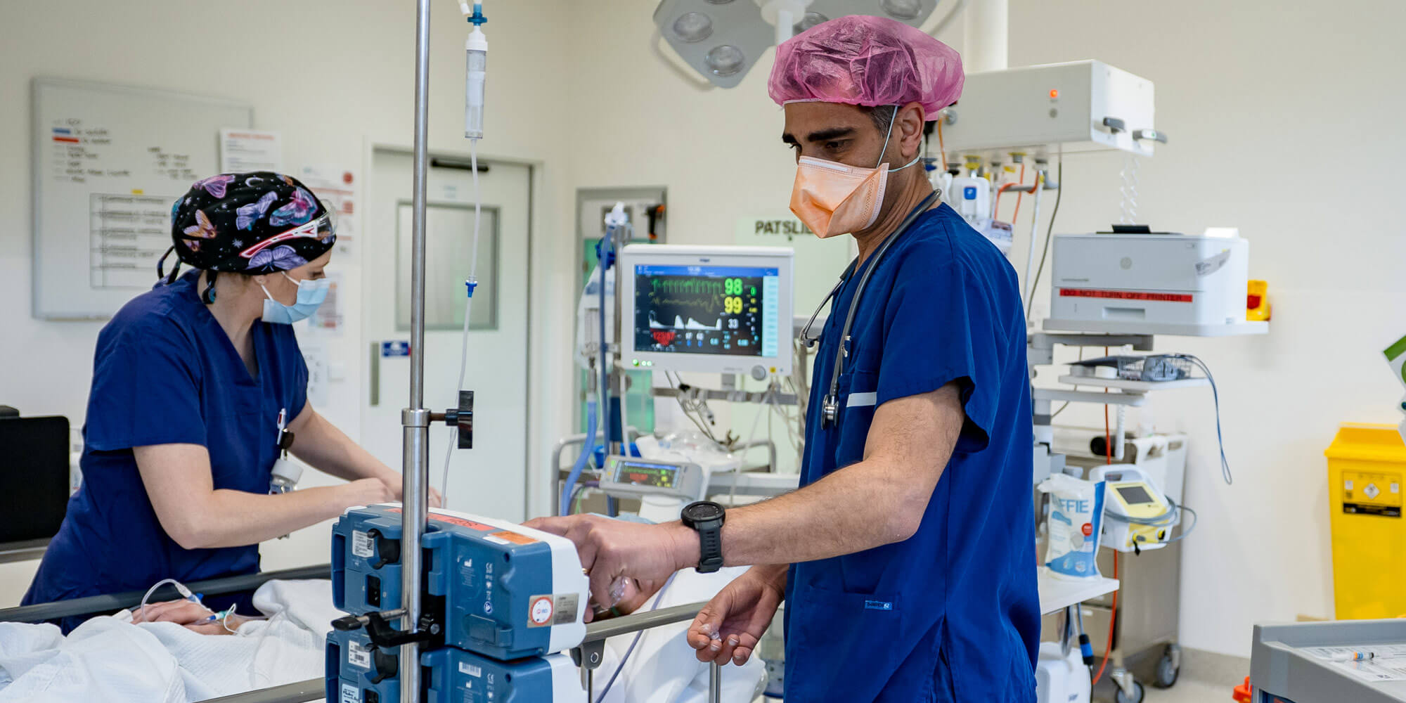 Doctor in theature preparing patient for surgery