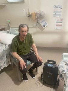 SGH patient, Mr Dunstone, with the donated oxygen concentrator