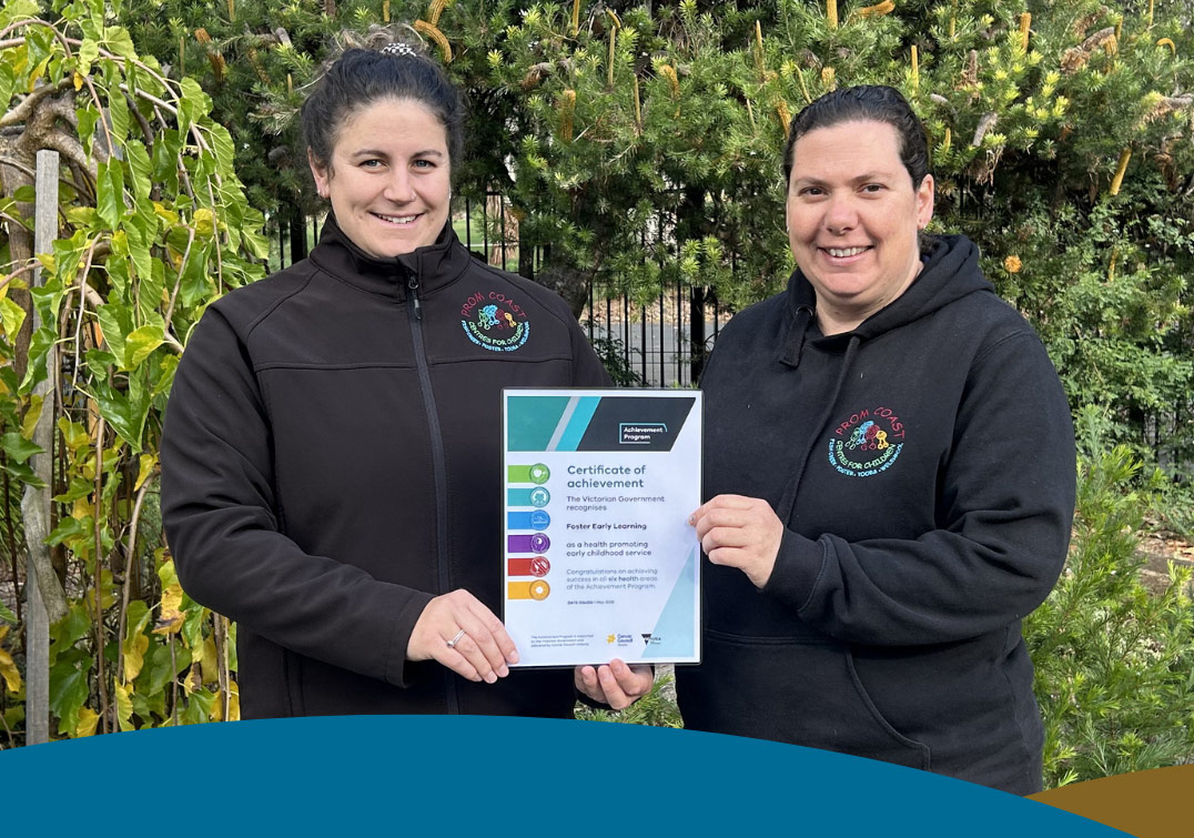 Two early learning staff from SGH with the early learning certificate of recognition